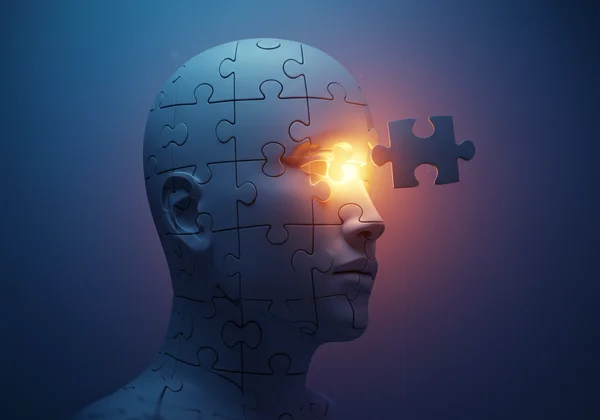 Puzzle pieces forming a face, representing self-discovery