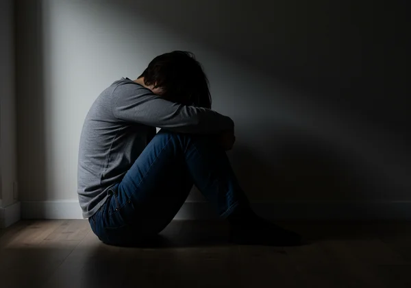 Person feeling profoundly exhausted, signaling autistic burnout